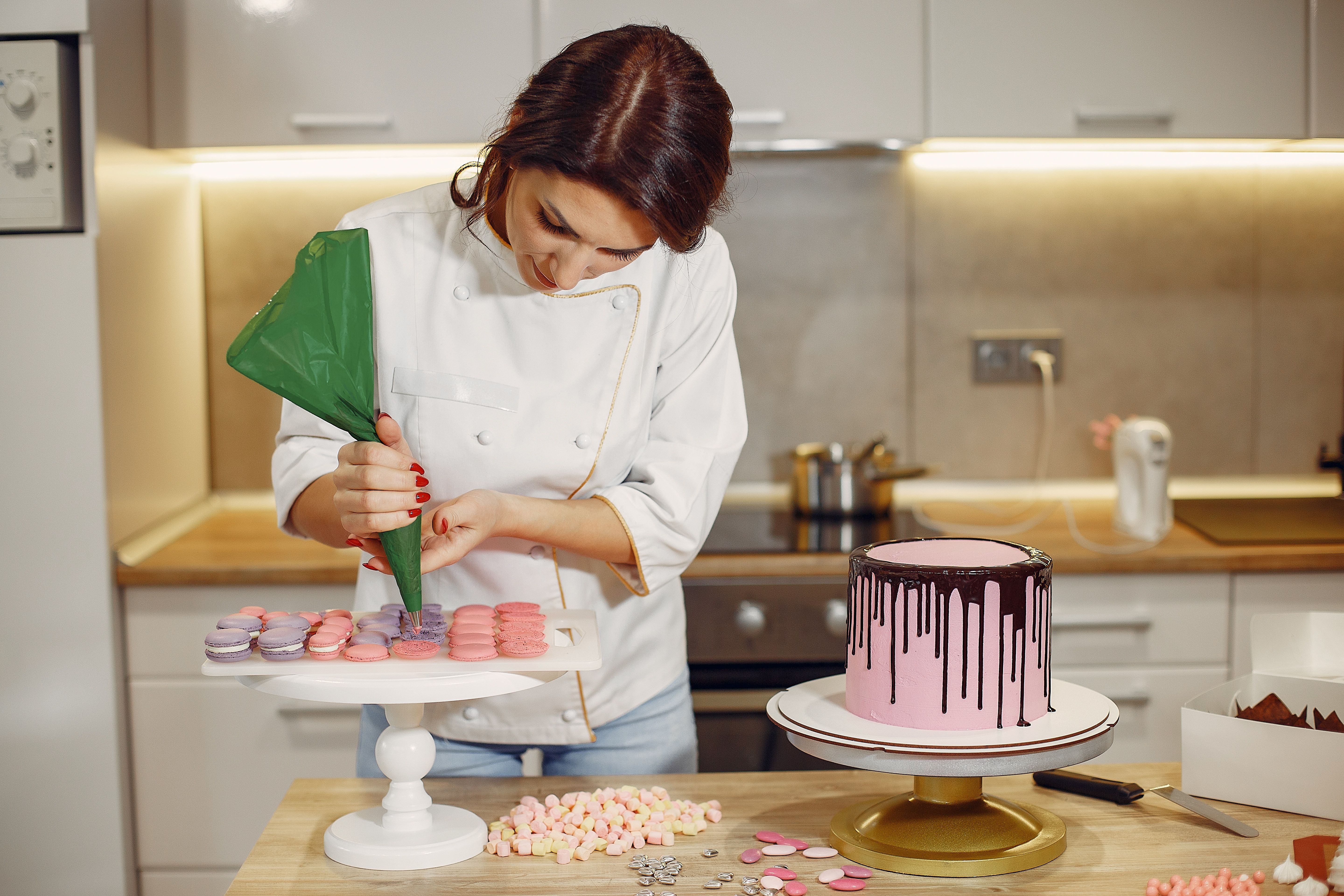 Professional baker decorating a cake